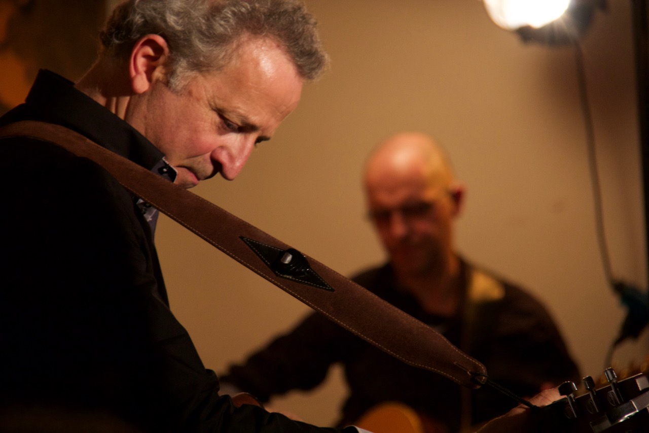 Barber 1 young man with beard smiling and wearing a  brown shirt